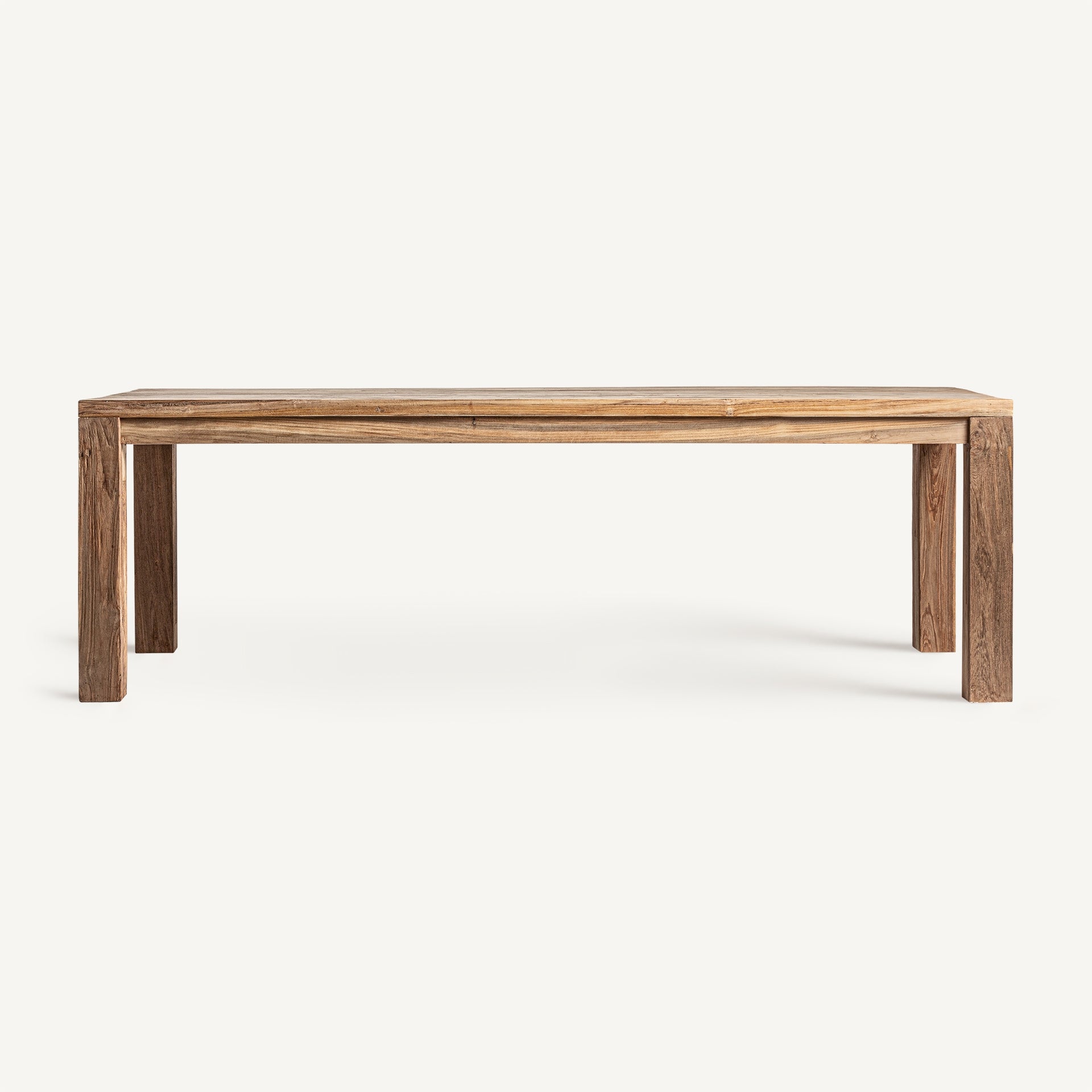 Mesa de comedor rectangular en madera de teca natural, líneas limpias y diseño sobrio