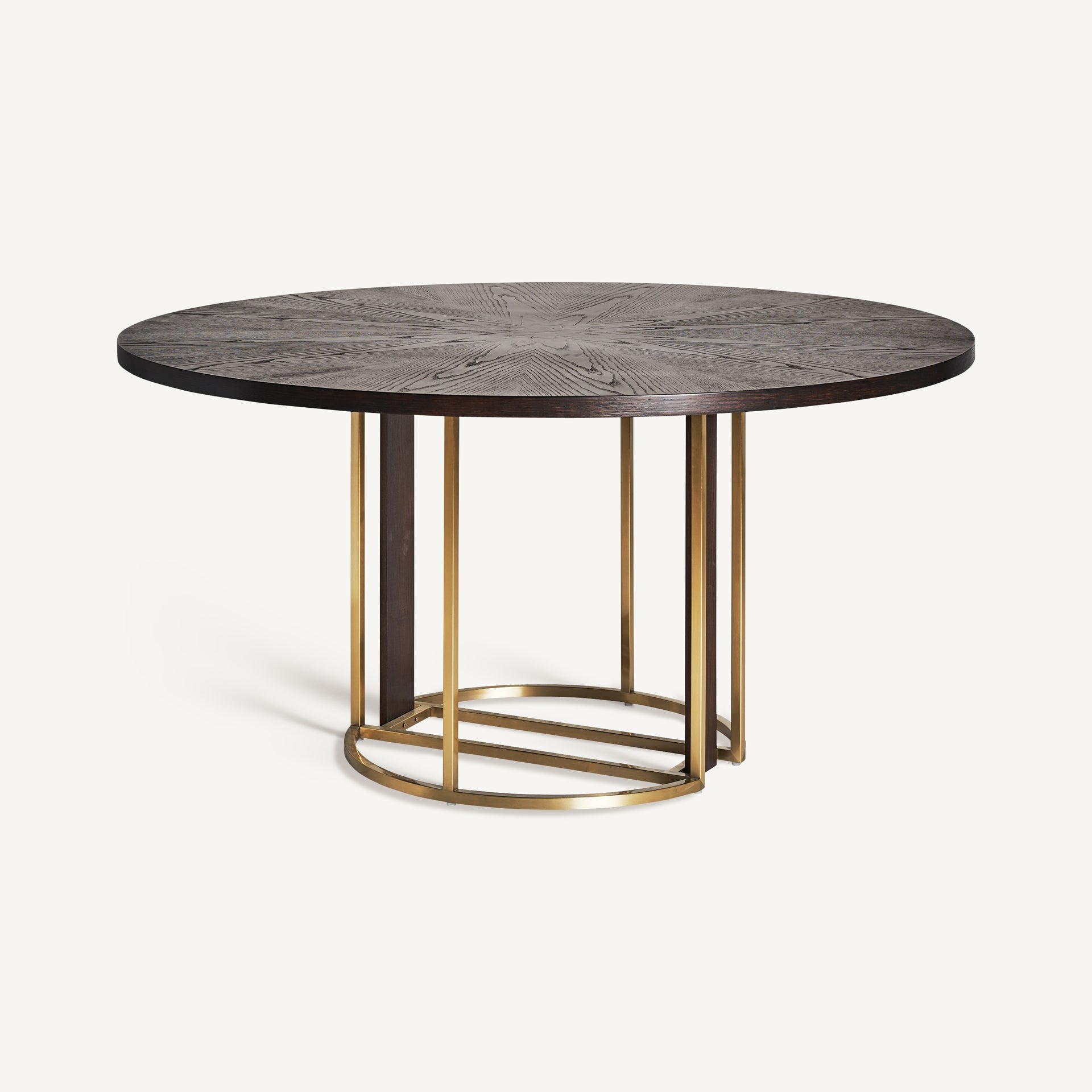 Mesa comedor redonda con base metálica dorada y tablero efecto estrella – vista en ángulo