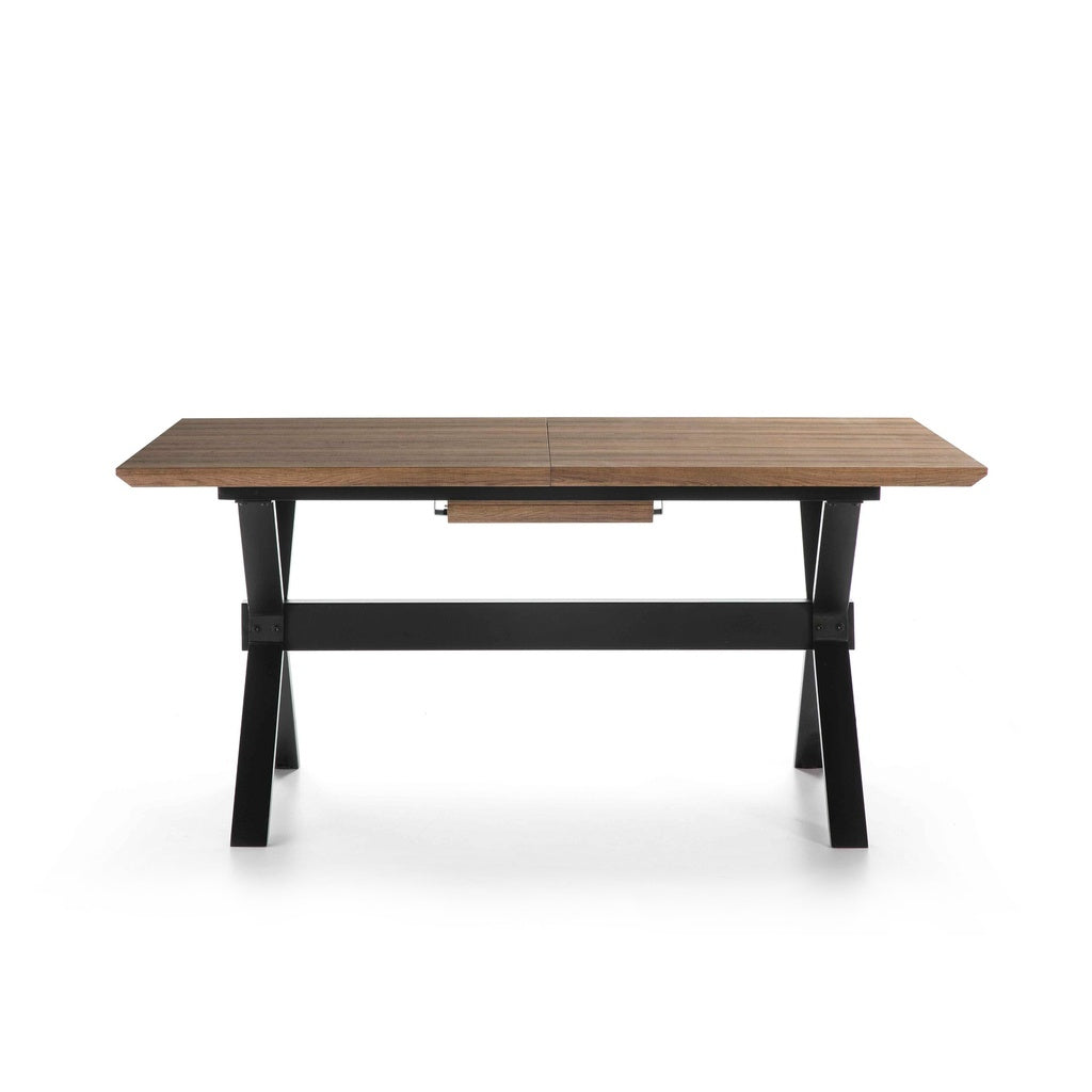 Mesa de comedor rectangular extensible con sobre de madera clara y patas en cruz metálica negra — elegancia moderna en Boutique Interiorismo.

