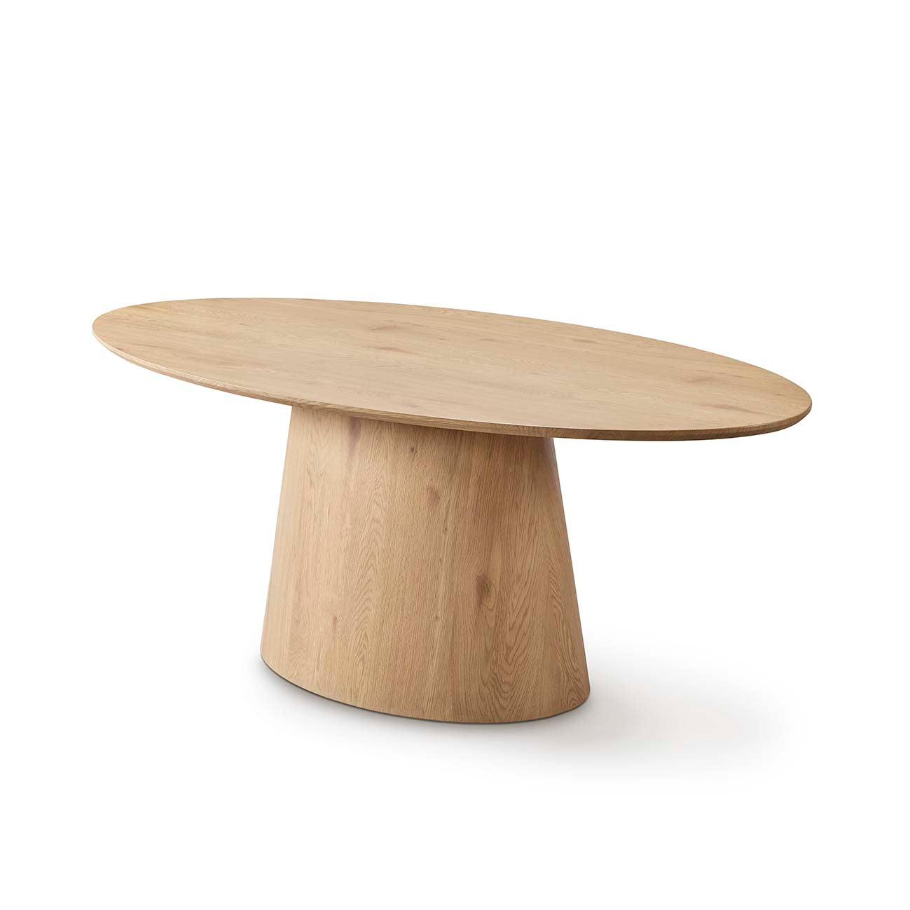 Mesa de comedor ovalada con base cilíndrica en tono neutro — equilibrio visual perfecto de Boutique Interiorismo.