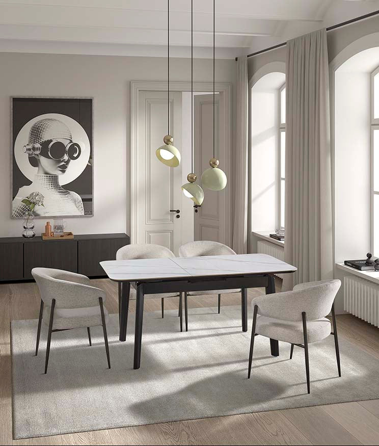 Espacio sofisticado con mesa negra contemporánea sobre alfombra clara — interiorismo sobrio y atemporal de Boutique Interiorismo.