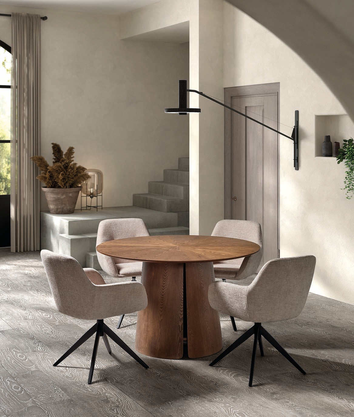 Mesa comedor redonda con tablero en estrella y acabado en nogal — pieza escultórica de lujo firmada por Boutique Interiorismo.