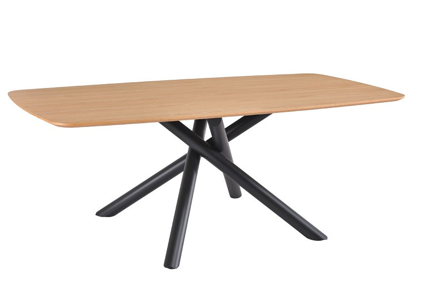 Mesa de comedor rectangular de madera natural con patas metálicas tubulares entrelazadas en color negro, diseño moderno y escultórico ideal para interiores con carácter. Boutique Interiorismo.