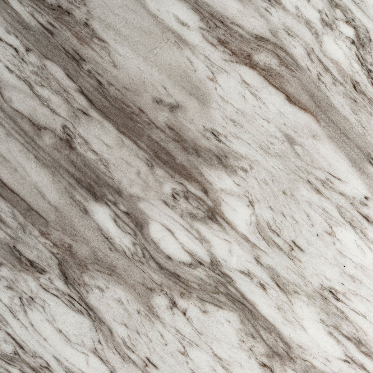 Textura frontal de la base metálica dorada con diseño acanalado vertical – boutique interiorismo VICAL