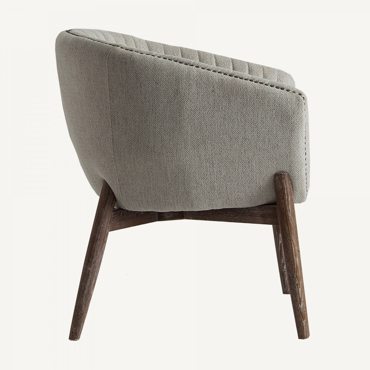 Vista lateral del sillón Neive mostrando estructura de madera oscura y diseño retro