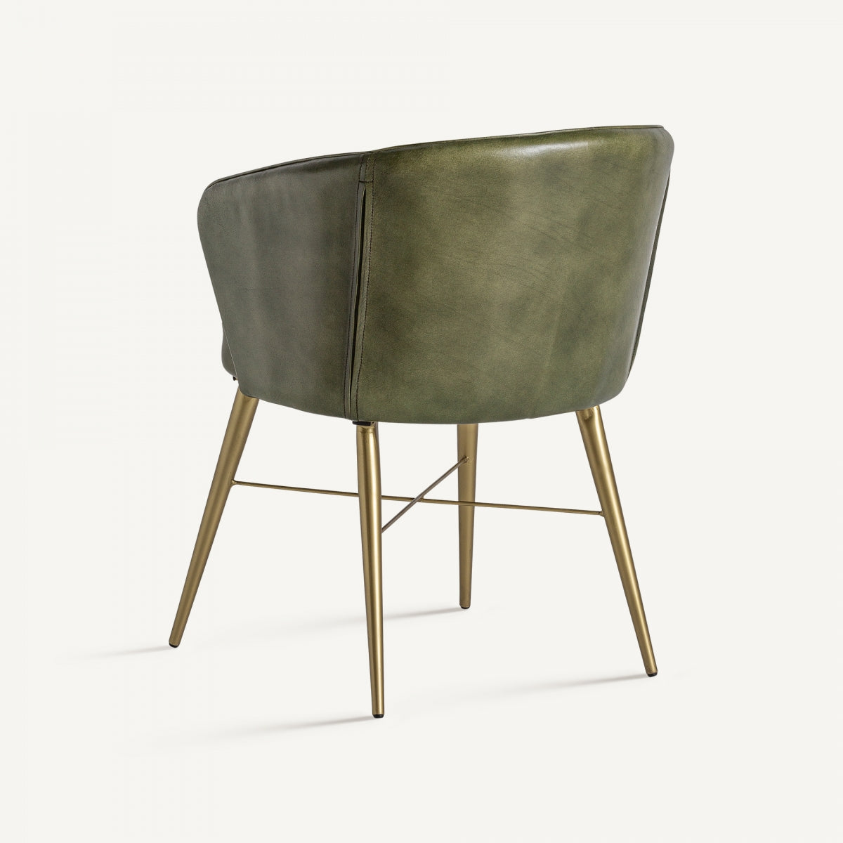 Parte trasera del sillón tapizado en piel verde con estructura metálica dorada