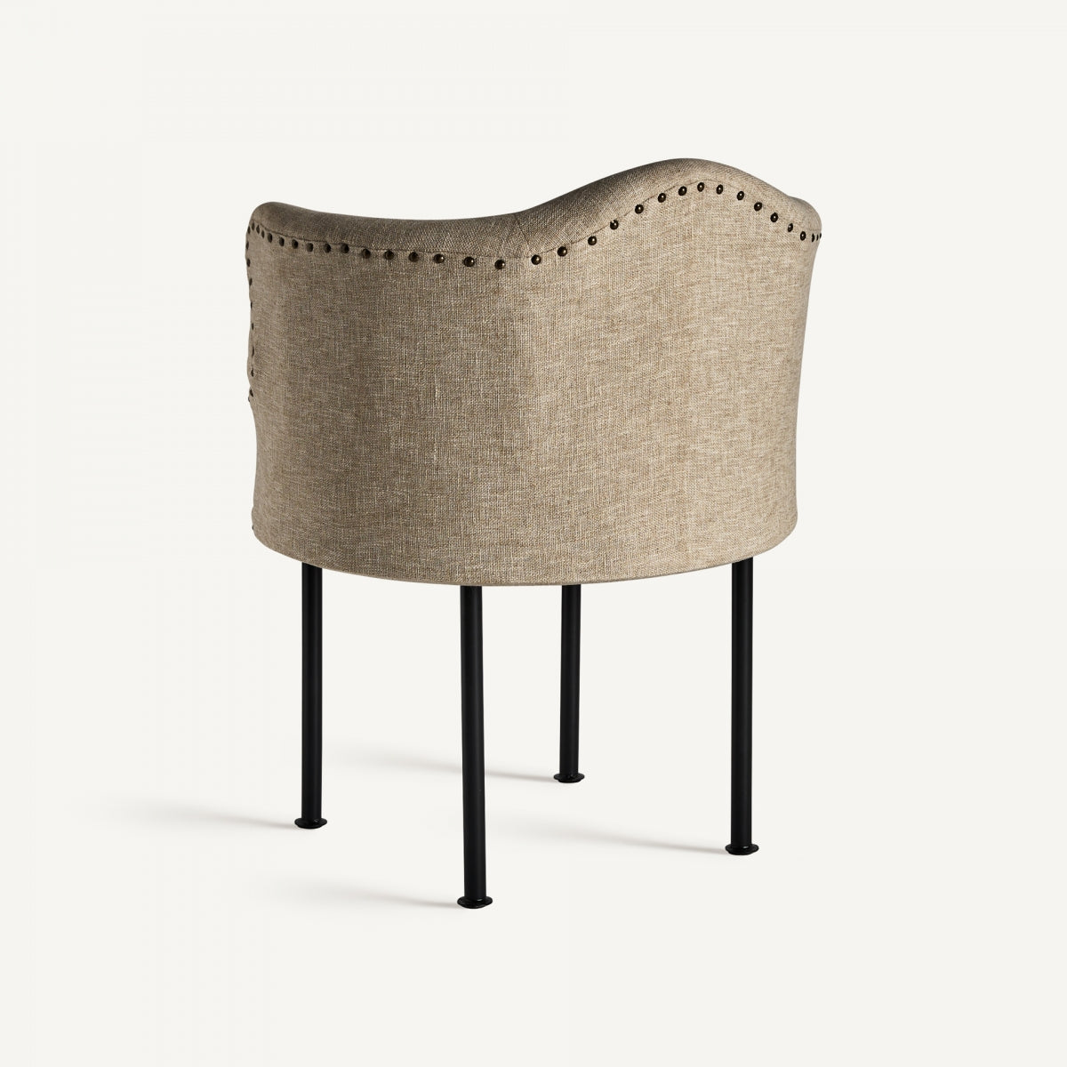 Parte trasera del sillón Crovie mostrando la curva orgánica del respaldo tapizado.